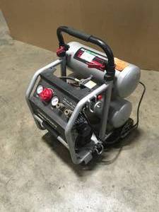 lot 13 image: Husky 4.5 Gal. Portable Electric-Powered Silent Air Compressor   Customer Returns See Pictures