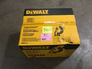 lot 15 image: DEWALT 15 Amp Corded 10 in. Compound Single Bevel Miter Saw Customer Returns See Pictures