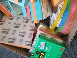 small box of post its and scotch ta...