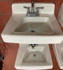 4 White vanity sinks with faucets