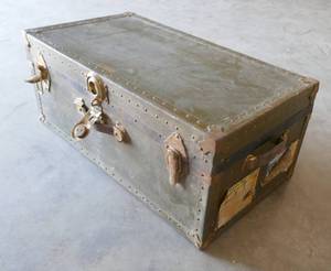 lot 7 image: Antique steam trunk with lots of shipping labels still on it