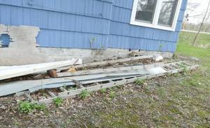 lot 17 image: 2 ladders - wood and aluminum and 2 wheel barrows