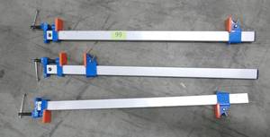 lot 99 image: 3 Wood clamps, 29 inches long