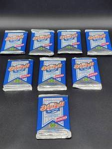 lot 32 image: Old New Stock Un-Opened (8) Packs of 1991 Upper Deck Baseball Cards