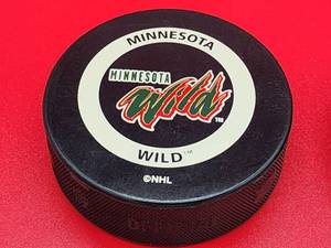 lot 99 image: (4) Official NHL Minnesota Wild Hockey Pucks