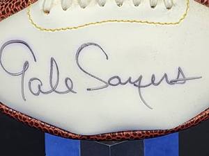 lot 300 image: Chicago Bears HOFer Great Gale Sayers Autographed Mini Football No COA