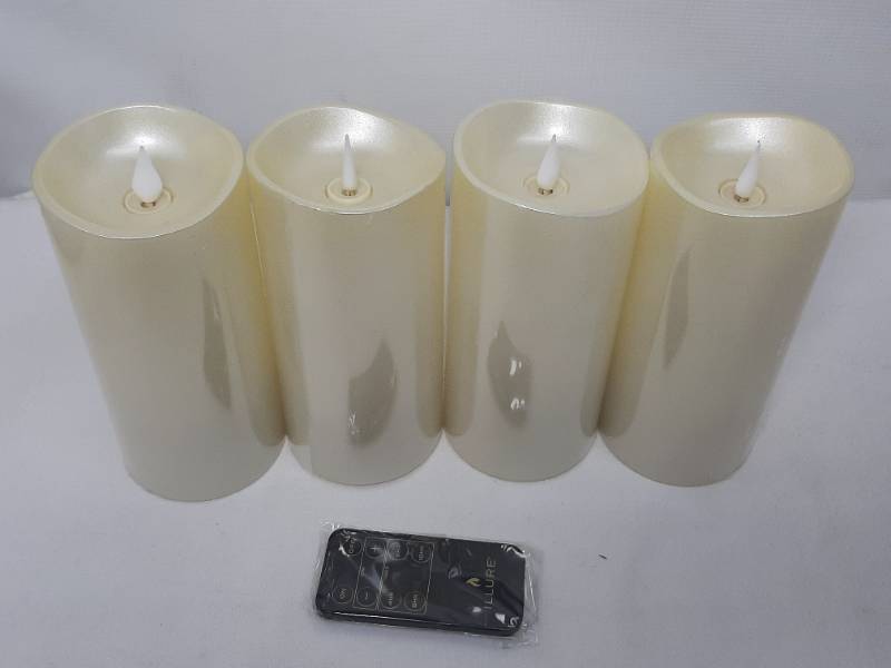 lot 909 image: Illure 4-Pack 7 Inch Lumi360 Battery Operated Candles Light Silver w Remote