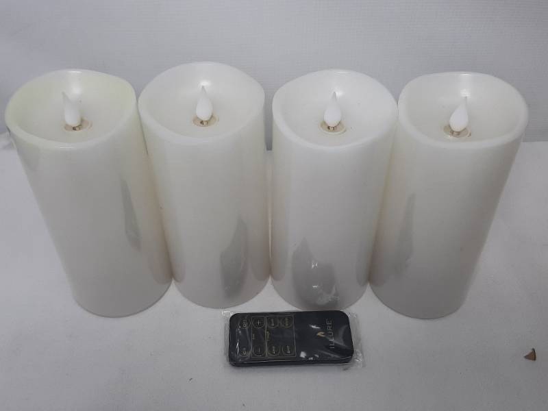lot 902 image: Illure 4-Pack 7 Inch Lumi360 Battery Operated Candles White w Remote
