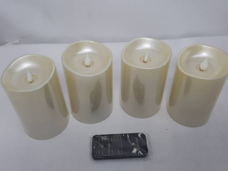 lot 903 image: Illure 4-Pack 5 Inch Lumi360 Battery Operated Candles Light Silver w Remote