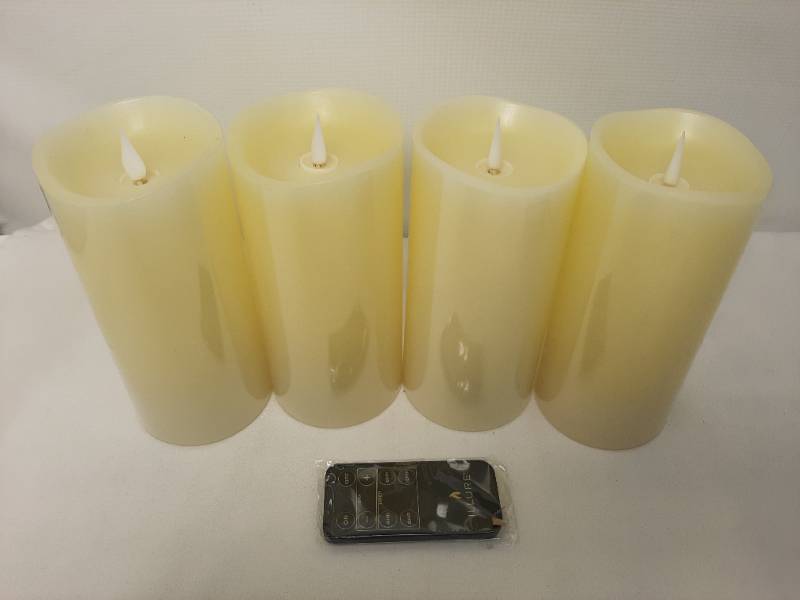 lot 904 image: Illure 4-Pack 7 Inch Lumi360 Battery Operated Candles Ivory w Remote