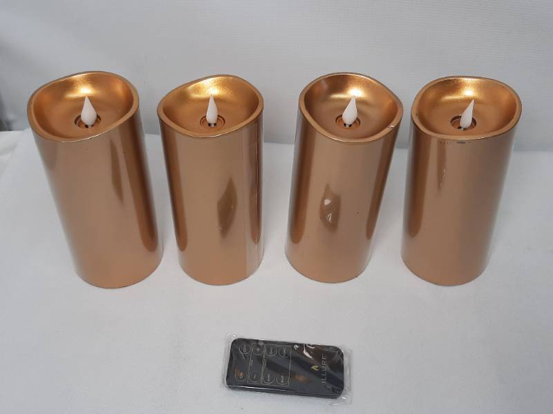 lot 908 image: Illure 4-Pack 7 Inch Lumi360 Battery Operated Candles Copper Gold w Remote