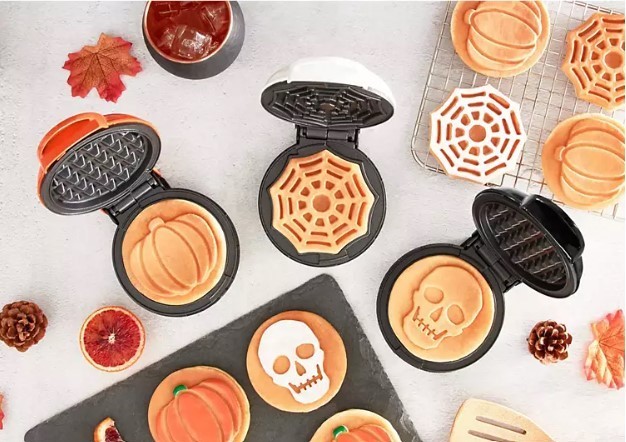 lot 579 image: NEW Dash Halloween Mini Waffle Set, includes Pumpkin, Skull and Spider Web Waffle Makers