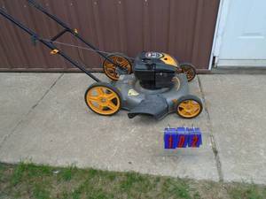 Ryobi push mower. Used condition. Tested & works. As shown.