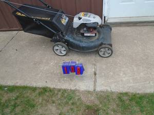 Yard Man push mower with bagger. Used condition. Tested & works. As shown.