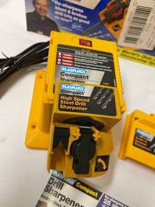 lot 276 image: Plasplugs Drill Sharpener in Original Box and Ryobi Rechargeable Drill Model HP496