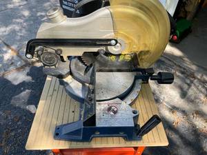 lot 296 image: Ryobi Miter Saw Model TS1301 with Metal Stand