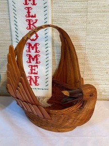 lot 386 image: Colorful Teapot, Trivet, Bird Shaped Basket and Valkommen Cross-stitch