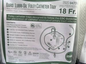 lot 92 image: MSRP $1000  Lot of 15 Bard 18FR Lubri-Sil Foley Catheter Tray with Anti-Reflux Chamber Drainage Bag and StatLock Foley Stabilization Device Expiration 1-23