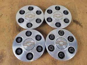 lot 803 image: (4) 6-Bolt Chevrolet Center Caps - Part No. 15712387