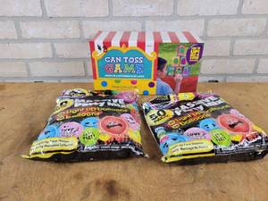 lot 815 image: (2) 50-packs of Party Balloons and can Toss Game