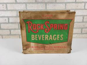 lot 176 image: Vintage Rock Spring Beverages Bottle Case - Shakopee, MN and Happy Sparkle Six-Pack Carton