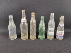 lot 189 image: (6) Vintage Bottle - Charles City Bottling Works Charles City, IA - PEPSI - Chisholm Bottling Works - Foreign Coca-Cola Bottle - REDNIB Yankton, SD - Clicquot Club Sparkling Water