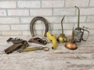 lot 376 image: Vintage Oil Cans, Horseshoe, Corn Husker and More