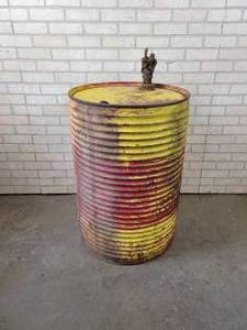 lot 377 image: Vintage Ribbed 55-Gallon Steel Oil Drum with Spout - NO SHIPPING