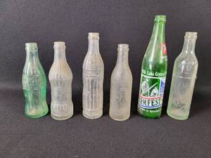 lot 383 image: (6) Vintage Bottles - Coca-Cola Lead S. Dakota -  Whale Brand Massolt Minneapolis, MN - Rapid City Bottling Works Rapid City, SD - 7-up Farmfest Bottle - Jacob Ries Bottling Shakopee, MN and Quaker Bottling Co. Minneapolis, MN