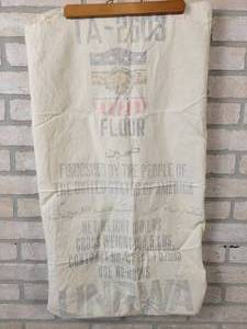 lot 390 image: 1950s 100# Four Sack - Furnished by the People of The United States of America