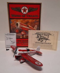 lot 54 image: Wings of Texaco 1930 Travel Air Model R Mystery Ship Die-Cast Metal Coin Bank (1997 Ertl Stock Number H501)