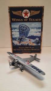 lot 56 image: Wings of Texaco 1927 Ford Tri-Motored Monoplane Die-Cast Metal Coin Bank (1999 Ertl Stock Number 36910)