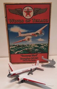 lot 59 image: Wings of Texaco Gooney Bird Douglas DC-3C Die-Cast Metal Coin Bank (2003 Ertl Stock Number 21255P-1HT)