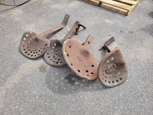 lot 133 image: (4) Antique Stamped Steel Tractor  Implement Seats and Bars - NO SHIPPING