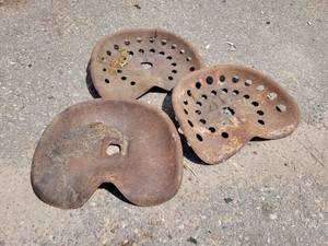 lot 135 image: (3) Antique Stamped Steel Tractor  Implement Seats