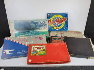 lot 336 image: Lot of (6) Vintage Board Games - Ranging from 1940s to 1970s - Bermuda Triangle Game, Kiddies Plus and Minus, Camelot, Civil War, Uncle Wiggly, and Easy Money.