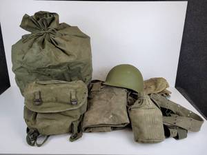 lot 338 image: Lot of Vintage Military Duffel Bags, Helmet, Canteen, and More