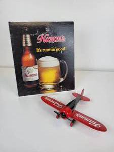 lot 26 image: Hamms Beer Airplane Coin Bank and Advertisement