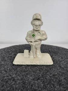 lot 403 image: Dotson Iron Casting Fertilizer Sales Paperweight