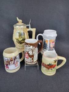 lot 431 image: Lot of (5) Beer Steins - Hamms Oktoberfest 1973, Budweiser, Hamms Holiday, Utica Club, and Wolves