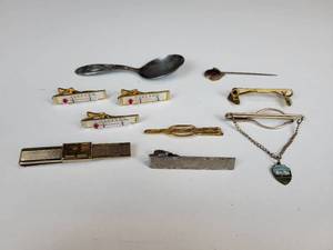 lot 539 image: Lot of (9) Vintage Tie Clips and Silver Plated Baby Spoon