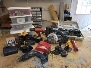 lot 54 image: Large Lot of Assorted Cordless Tools Parts and Batteries - Some unused replacement cells for battery packs - NO SHIPPING
