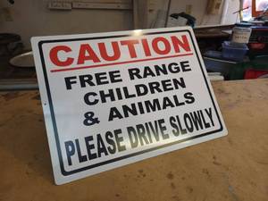 lot 92 image: CAUTION Free Range Children & Animals, Please Drive Slowly Tin Sign