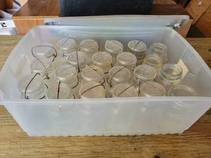 lot 127 image: Lot of (18) Glass Lid and Wire Bail Quart Jars - Ball, Drey & Deckers Iowana and (4) Standard Jars with Various Designs - NO SHIPPING