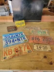 lot 183 image: Model T Buzz Coil, Vintage Minnesota, Iowa, and Illinois License Plates
