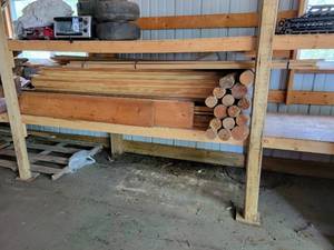 lot 238 image: Shelf of Lumber - (160) 3-34 x 516 x 7  - (11) Round Posts - 3-12 diameter x 48, (3) Round Posts - 4-12 diameter x 48, (10) Tongue & Groove Boards - 1-34 x 34 x 7, and More NO SHIPPING