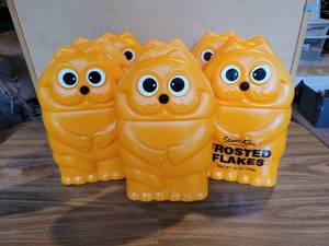 lot 315 image: (8) Vintage Blow Mold Heathcliff Sugar Frosted Flakes Cereal Containers
