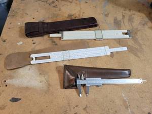 lot 451 image: Lot of Precision Measuring Instruments - Vintage Caliper and Pair of Vintage Slide Rules