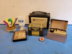 lot 1066 image: Vintage QSO Tin Box, Johnson Two-Way Radio Tape Measure, GE Transistor Radio, Antique Continental Resistor Tin Box and More