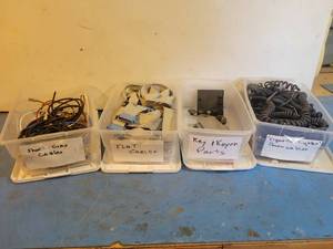 lot 1239 image: (4) Totes of Assorted Cables and Parts
